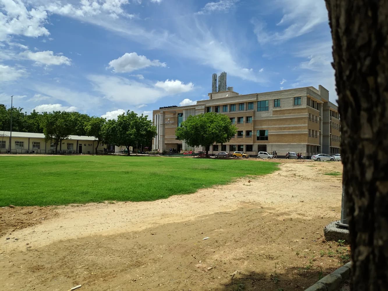 Ramanujan College main building and cricket ground