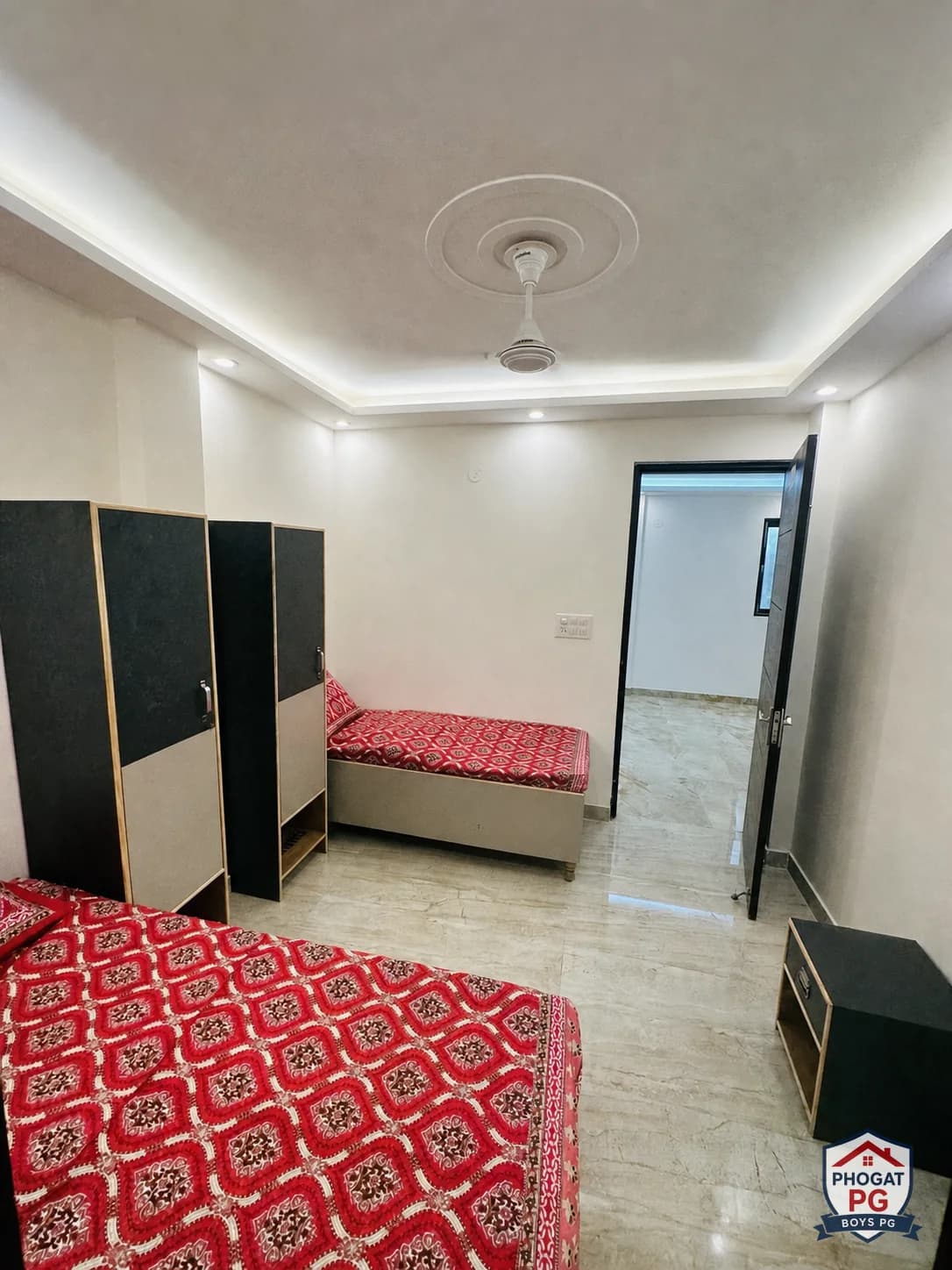 Two beds and individual wardrobes in a Phogat PG room