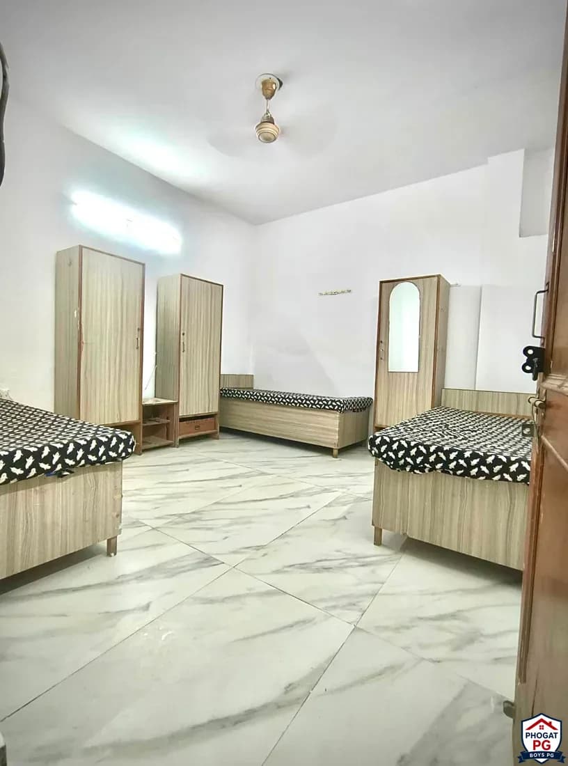 Three visible beds with individual wardrobes and tiled flooring